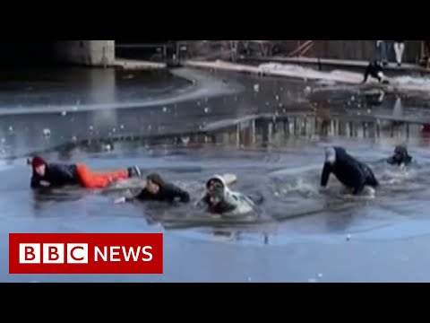 Group of skaters rescued after falling through ice – BBC News