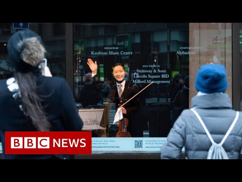 Live music returns behind a New York shop window – BBC News