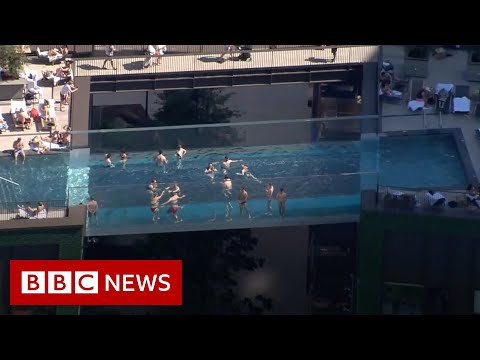 World’s first ‘floating’ pool suspended between London tower blocks – BBC News