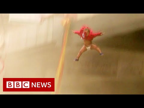 Baby thrown from building ‘set on fire by looters’ in South Africa – BBC News