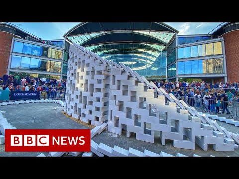 Giant concrete dominoes fall to start UK festival – BBC News