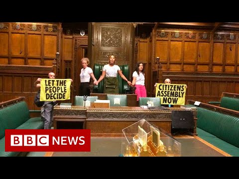 Extinction Rebellion climate activists glue themselves together in UK Parliament – BBC News