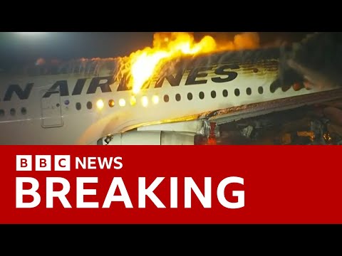 Japan Airlines plane in flames on the runway at Tokyo’s Haneda Airport -BBC News