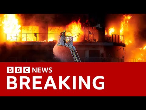 Firefighters battle huge blaze engulfing  apartment block in Spain | BBC News