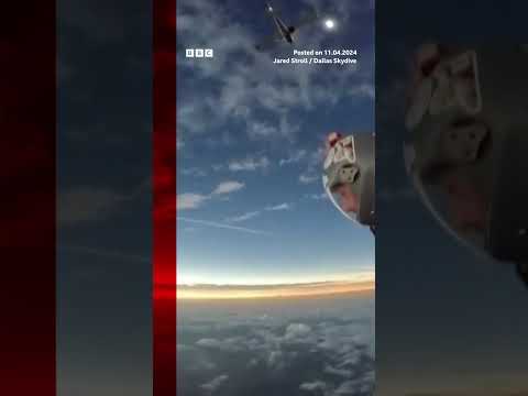 Skydivers witness total solar eclipse mid-air. #Shorts #Eclipse #BBCNews