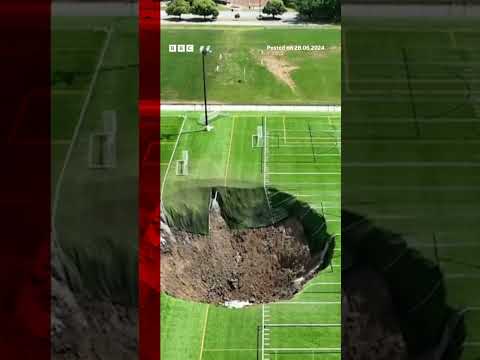 Watch moment sinkhole swallows football pitch leaving a 100 feet wide (30.5m) hole. #BBCNews