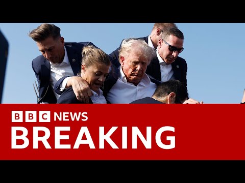 Moment Donald Trump was rushed off stage after shots fired at rally | BBC News