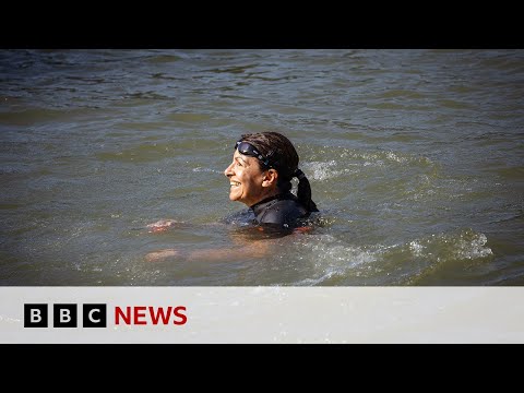 Paris mayor swims in Seine to prove water clean enough for Olympics | BBC News